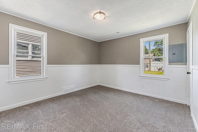 23736 Mac Arthur Blvd, Warren, MI 48089 - carpeted empty room featuring electric panel, a textured ceiling, and ornamental molding