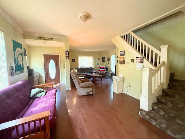 512 E Main St, Owosso, MI 48867 - living room with ornamental molding, stairs, and wood finished floors