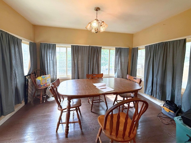 512 E Main St, Owosso, MI 48867 - dining space featuring healthy amount of natural light, dark wood finished floors, and a chandelier