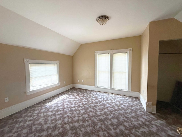 512 E Main St, Owosso, MI 48867 - bonus room with vaulted ceiling, carpet flooring, and plenty of natural light