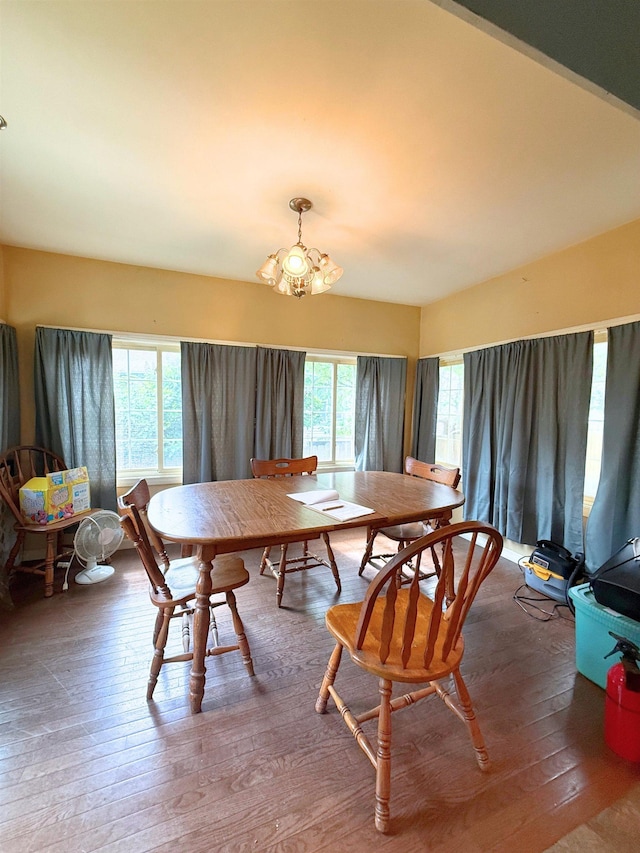 512 E Main St, Owosso, MI 48867 - dining space featuring a chandelier and hardwood / wood-style floors