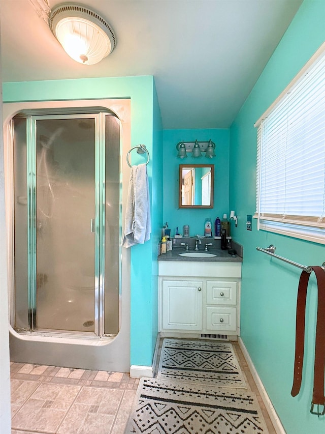 512 E Main St, Owosso, MI 48867 - bathroom with a stall shower and vanity