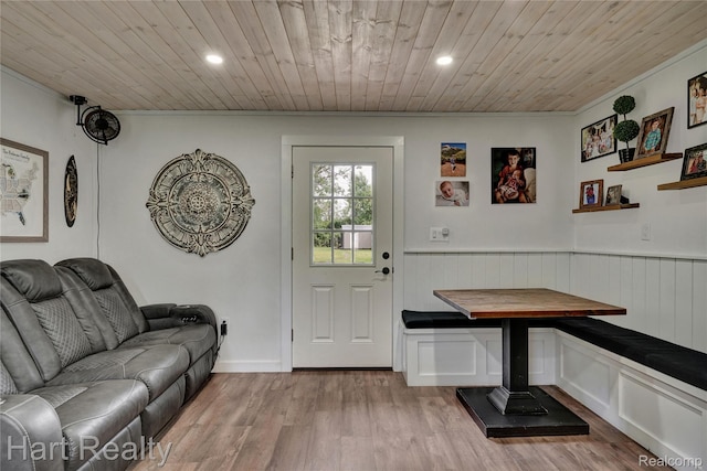 1191 W Frenchline Rd, Sandusky, MI 48471 - entryway featuring wood ceiling, light wood-style floors, crown molding, recessed lighting, and wainscoting