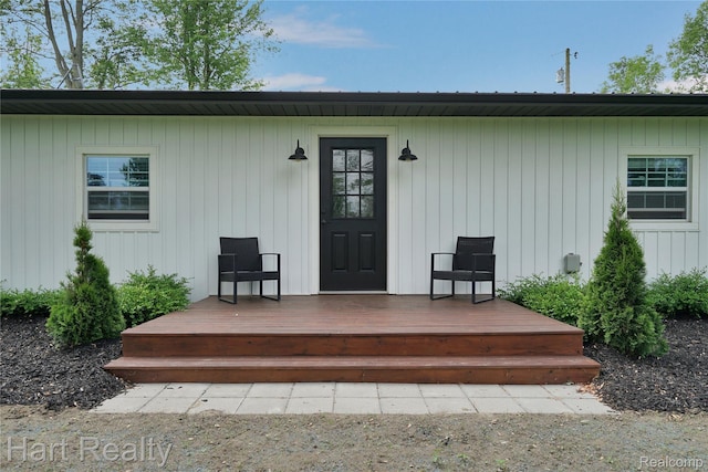 1191 W Frenchline Rd, Sandusky, MI 48471 - view of exterior entry with a wooden deck