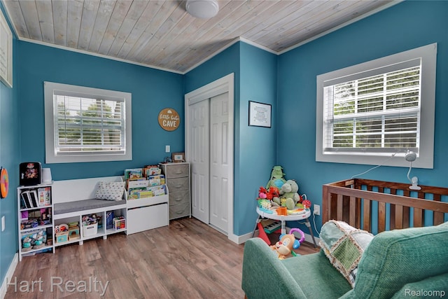 1191 W Frenchline Rd, Sandusky, MI 48471 - rec room featuring healthy amount of natural light, ornamental molding, wood finished floors, and wooden ceiling