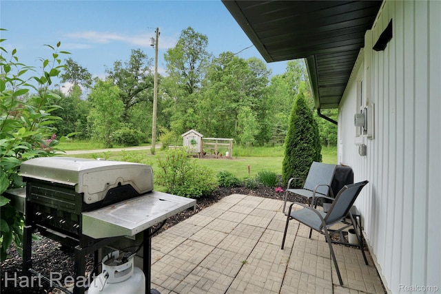 1191 W Frenchline Rd, Sandusky, MI 48471 - view of patio / terrace with grilling area and an outbuilding