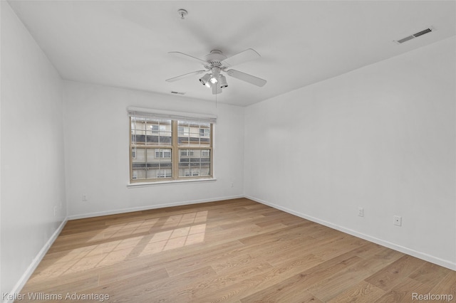 438 Old Pine Way, Walled Lake, MI 48390 - empty room with a ceiling fan, light wood-style floors, and fire sprinkler in ceiling