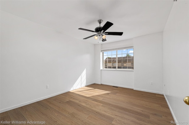 438 Old Pine Way, Walled Lake, MI 48390 - empty room featuring wood finished floors and a ceiling fan