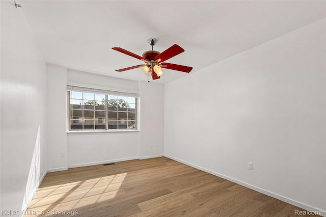 438 Old Pine Way, Walled Lake, MI 48390 - spare room with wood finished floors and ceiling fan