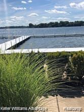 438 Old Pine Way, Walled Lake, MI 48390 - view of swimming pool with a water view