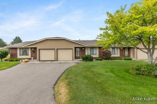 666 Waterview Ct SW, Grandville, MI 49418 - single story home with brick siding, a garage, and a front yard