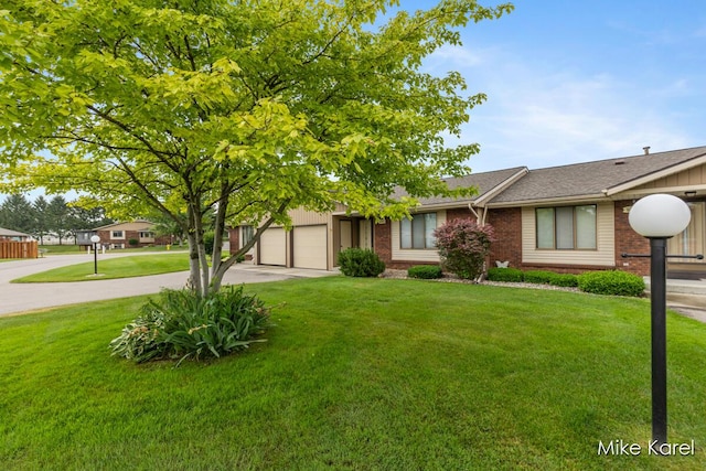 666 Waterview Ct SW, Grandville, MI 49418 - view of front of home with driveway, brick siding, a front yard, a garage, and roof with shingles