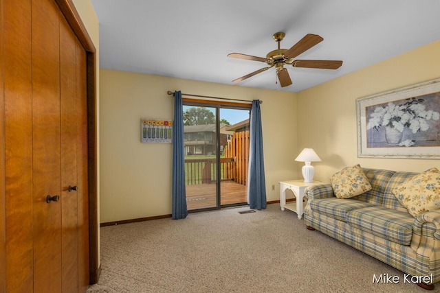 666 Waterview Ct SW, Grandville, MI 49418 - living area featuring carpet floors and a ceiling fan