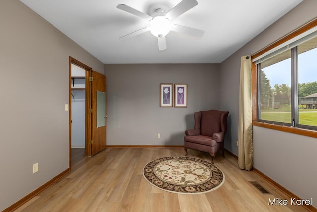666 Waterview Ct SW, Grandville, MI 49418 - sitting room with light wood finished floors and ceiling fan