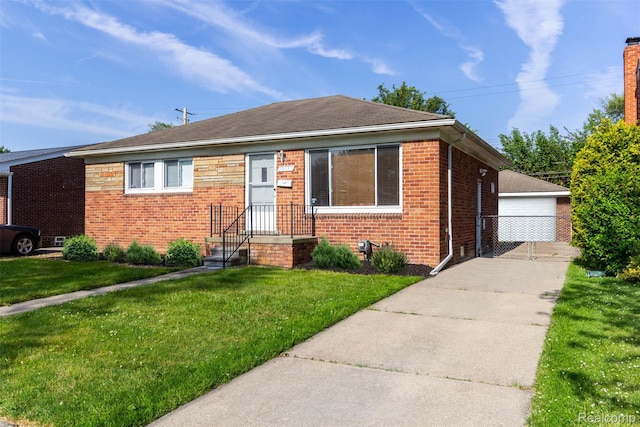 24645 Greenbrier Ave, Eastpointe, MI 48021 - bungalow-style house with brick siding, a front lawn, and a garage