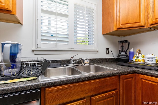 24645 Greenbrier Ave, Eastpointe, MI 48021 - kitchen with dishwashing machine, dark countertops, and brown cabinets