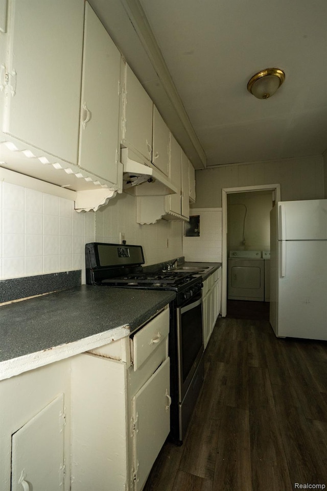 21890 Sharkey St, Clinton Township, MI 48035 - kitchen featuring freestanding refrigerator, under cabinet range hood, range with gas stovetop, dark wood-style floors, and dark countertops