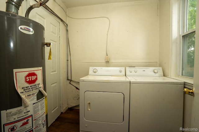 21890 Sharkey St, Clinton Township, MI 48035 - laundry room featuring water heater, washing machine and dryer, and dark wood-type flooring