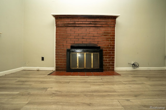 21890 Sharkey St, Clinton Township, MI 48035 - detailed view of wood finished floors and a brick fireplace