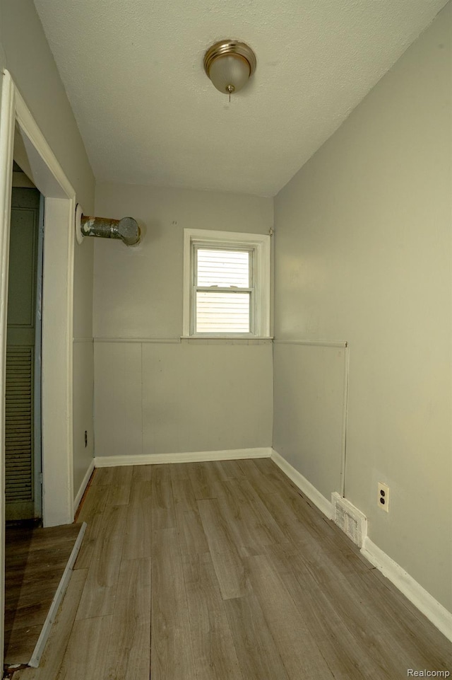 21890 Sharkey St, Clinton Township, MI 48035 - unfurnished room with wood finished floors and baseboards