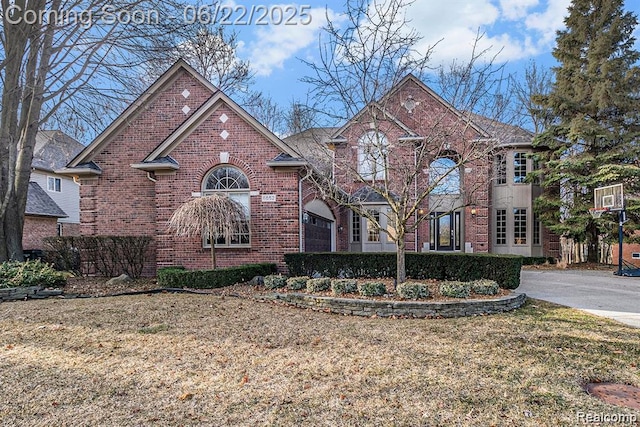 6652 Chianti Ct, Shelby Twp, MI 48316 - view of front facade with brick siding and a front yard