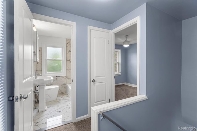16629 Hubbell St, Garden City, MI 48235 - bathroom featuring marble look tile flooring and ceiling fan