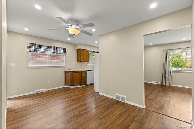 7420 Colonial St, Dearborn Heights, MI 48127 - kitchen with dishwasher, dark wood-style flooring, a ceiling fan, brown cabinets, and light countertops