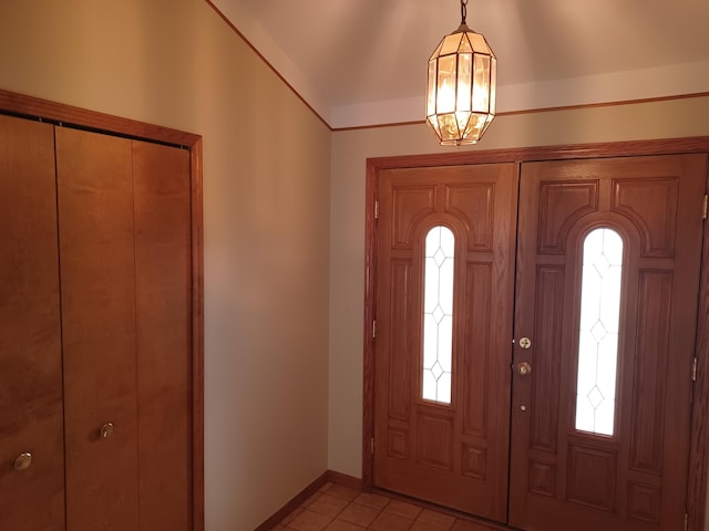 46817 Barbara Dr, Macomb, MI 48044 - foyer featuring light tile patterned flooring, plenty of natural light, and a chandelier