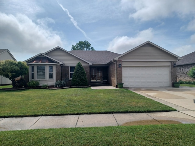 46817 Barbara Dr, Macomb, MI 48044 - single story home with an attached garage, brick siding, driveway, a front yard, and roof with shingles
