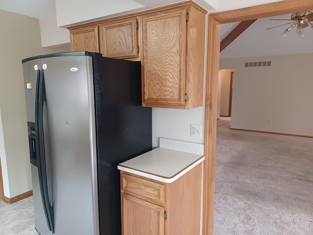 46817 Barbara Dr, Macomb, MI 48044 - kitchen with refrigerator with ice dispenser, a ceiling fan, light countertops, and light colored carpet