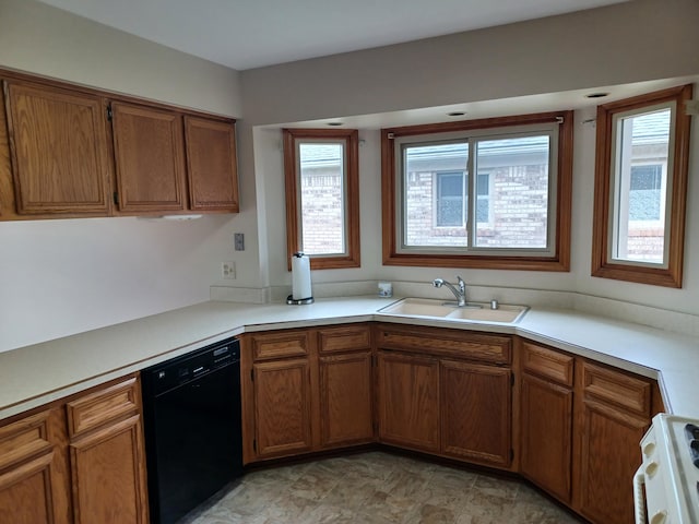 46817 Barbara Dr, Macomb, MI 48044 - kitchen with black dishwasher, healthy amount of natural light, stove, and brown cabinets