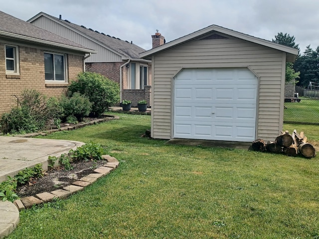 46817 Barbara Dr, Macomb, MI 48044 - view of front of house with brick siding, a chimney, and a detached garage