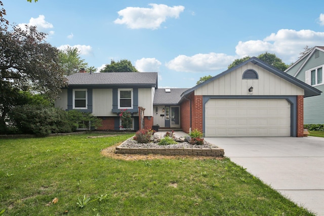 3320 Bluett Dr, Ann Arbor, MI 48105 - tri-level home with brick siding, concrete driveway, a garage, and a front yard