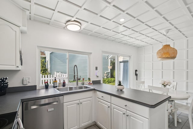3320 Bluett Dr, Ann Arbor, MI 48105 - kitchen featuring stainless steel dishwasher, a peninsula, white cabinets, dark countertops, and tile patterned floors