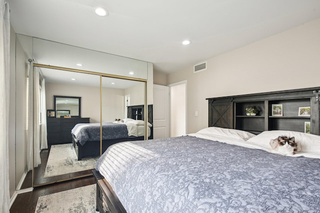 3320 Bluett Dr, Ann Arbor, MI 48105 - bedroom with dark wood finished floors, recessed lighting, and a closet