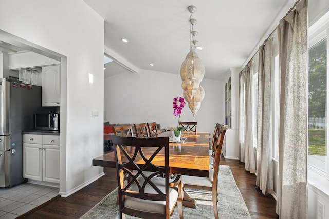 3320 Bluett Dr, Ann Arbor, MI 48105 - dining area featuring healthy amount of natural light, wood finished floors, recessed lighting, and lofted ceiling