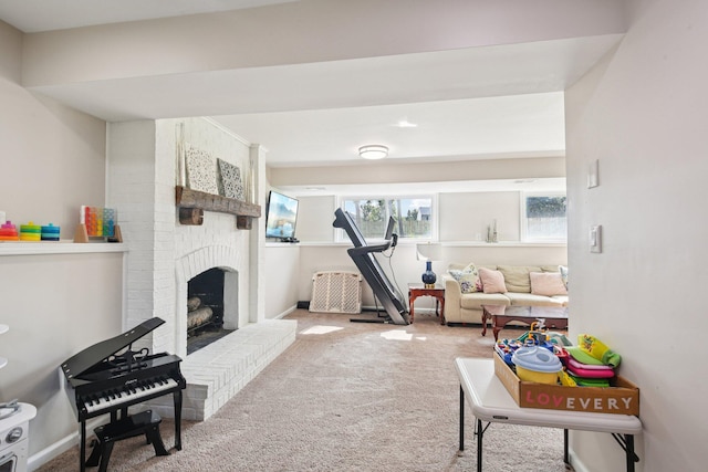 3320 Bluett Dr, Ann Arbor, MI 48105 - carpeted living room with a brick fireplace and baseboards
