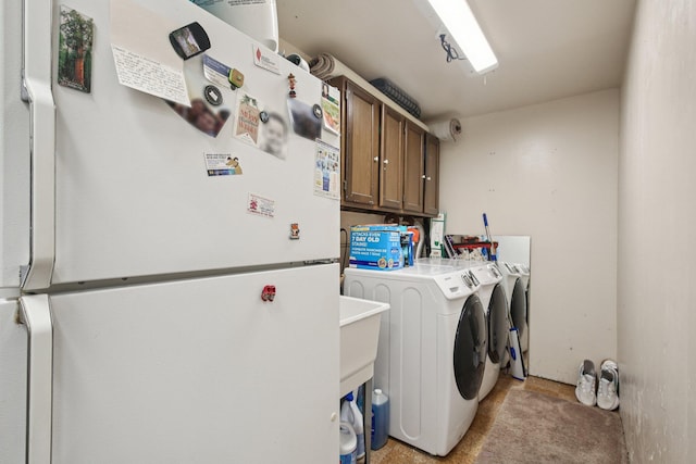 3320 Bluett Dr, Ann Arbor, MI 48105 - laundry area featuring cabinet space and separate washer and dryer