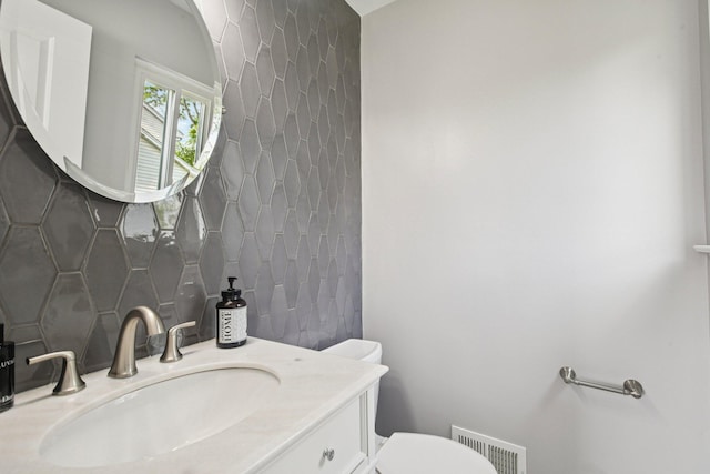 3320 Bluett Dr, Ann Arbor, MI 48105 - bathroom with backsplash and vanity