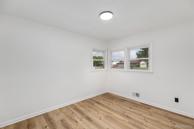 16952 Mount Vernon St, Wixom, MI 48075 - unfurnished room with baseboards and light wood finished floors
