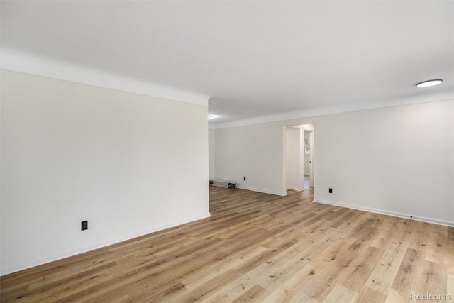 16952 Mount Vernon St, Wixom, MI 48075 - empty room with light wood-style floors and baseboards