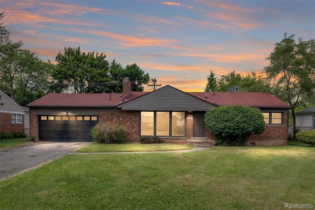 16952 Mount Vernon St, Wixom, MI 48075 - view of front of home with brick siding, driveway, an attached garage, a yard, and a chimney