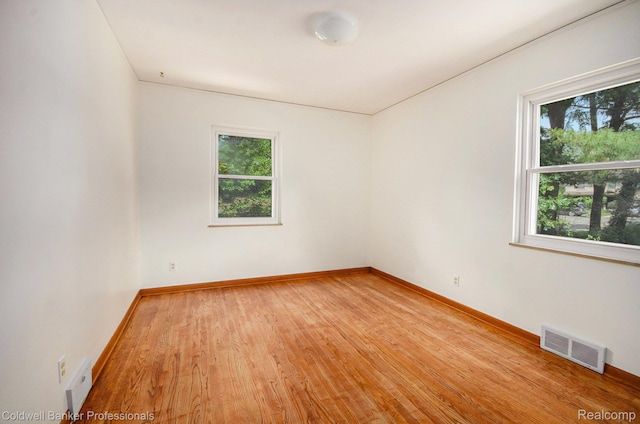 2740 Judah Rd, Lake Orion, MI 48359 - empty room with healthy amount of natural light and light wood finished floors