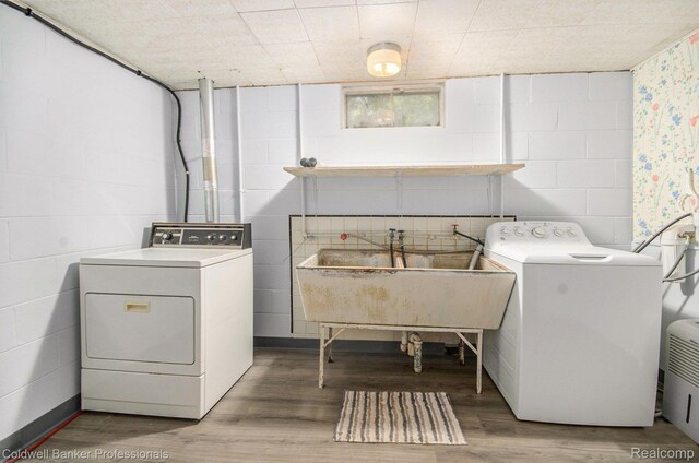 2740 Judah Rd, Lake Orion, MI 48359 - washroom featuring washer and clothes dryer, wood finished floors, and concrete block wall