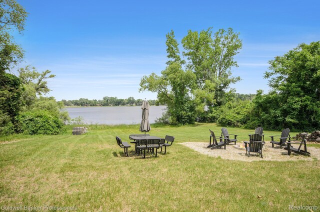 2740 Judah Rd, Lake Orion, MI 48359 - view of green lawn featuring an outdoor fire pit and a water view