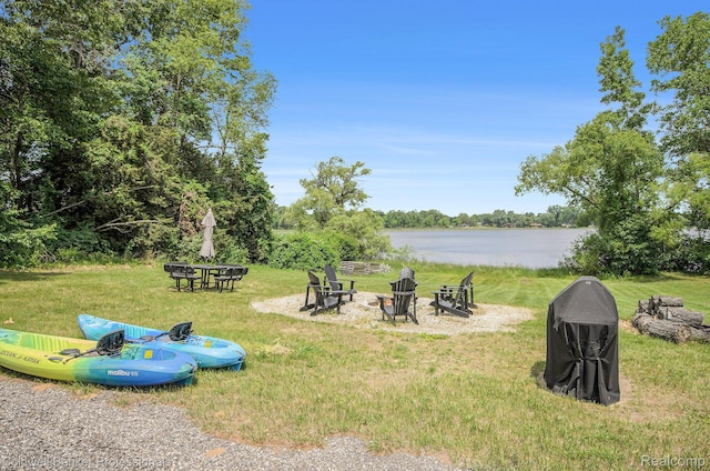 2740 Judah Rd, Lake Orion, MI 48359 - view of green lawn featuring an outdoor fire pit and a water view