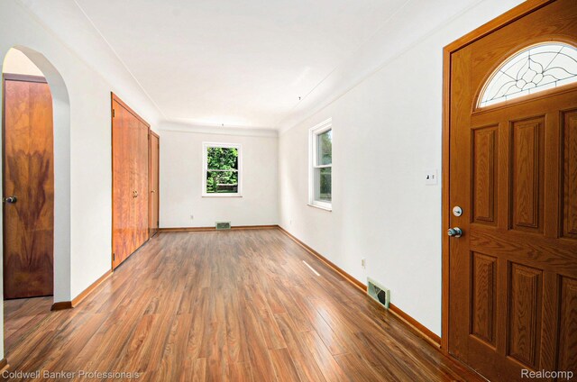 2740 Judah Rd, Lake Orion, MI 48359 - entrance foyer featuring light wood-style flooring and arched walkways