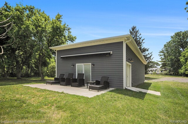 2740 Judah Rd, Lake Orion, MI 48359 - back of property with a patio area and a yard