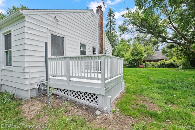 26389 Annapolis St, Dearborn Heights, MI 48125 - view of property exterior with a wooden deck, a chimney, and a yard
