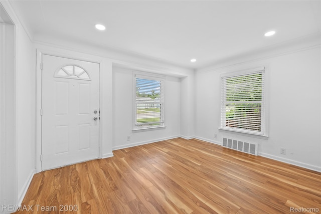 26389 Annapolis St, Dearborn Heights, MI 48125 - entrance foyer with light wood finished floors, ornamental molding, and recessed lighting